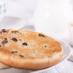Tea with a traditional British teacake of raisins, sultanas and